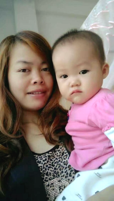 GSN employee Cailan Ma with her child